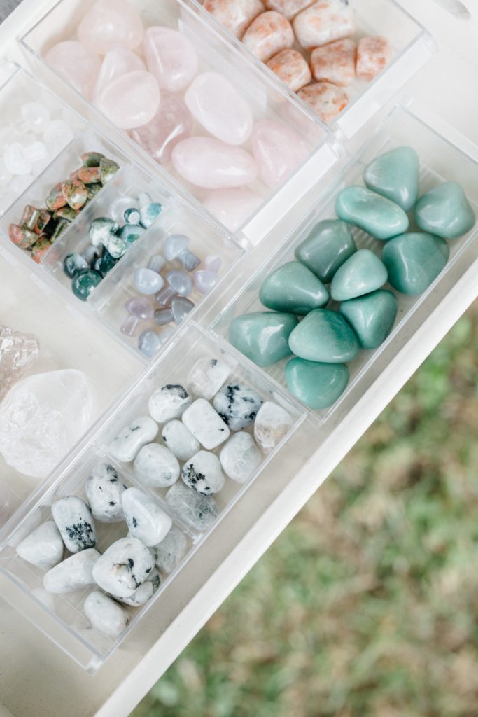 A white tray filled with different types of stones.