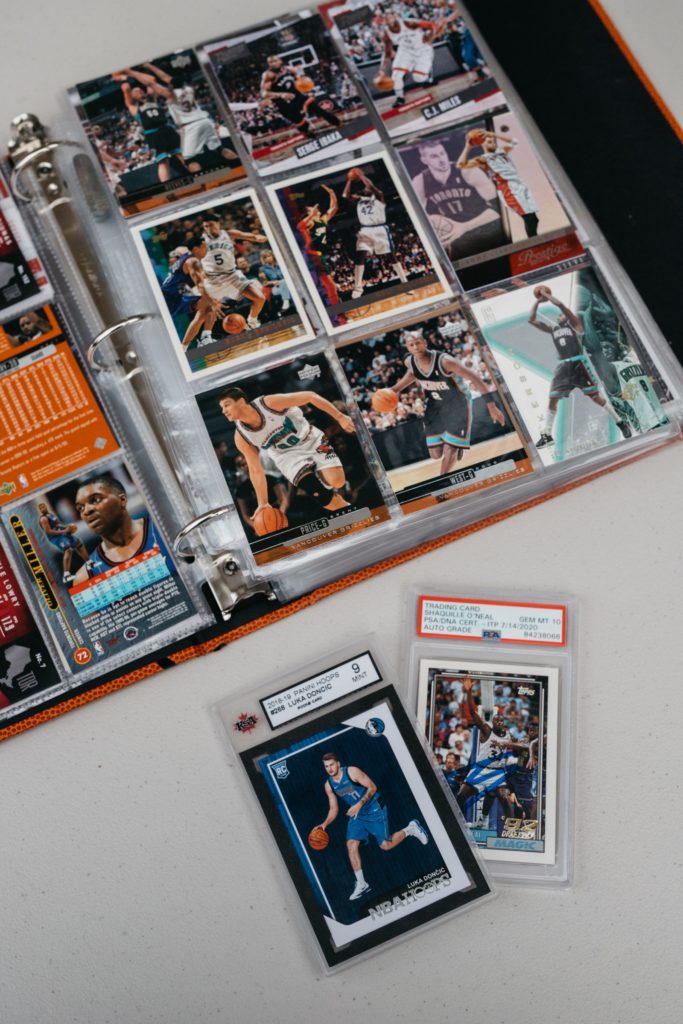 A binder full of basketball cards and cards.