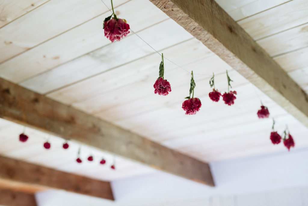 Photo of flowers hanging in the ceiling